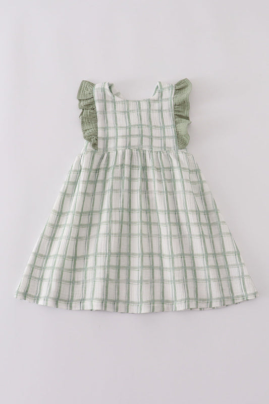 Green checkered dress on a light gray background