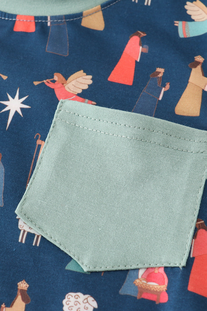 Close-up of a green pocket on fabric with angel pattern