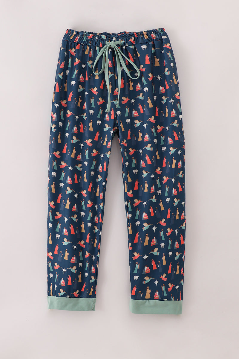 Navy blue pajama pants with colorful fox pattern on a light gray background
