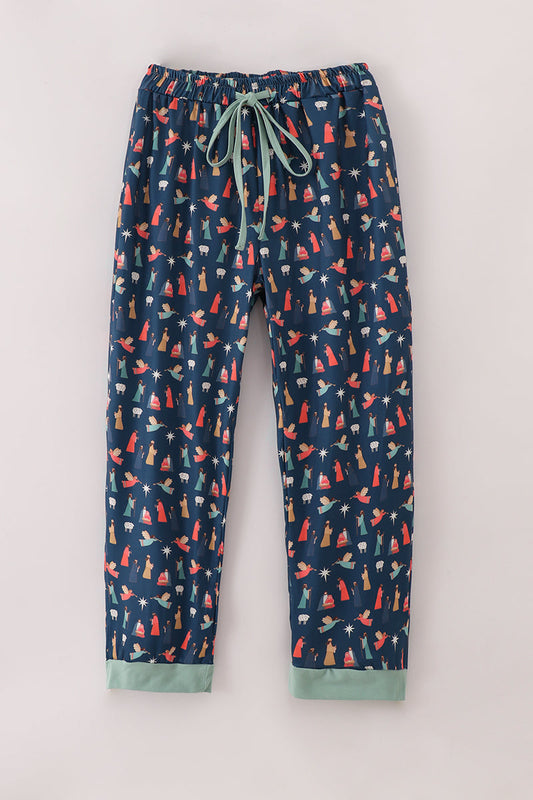 Navy blue pajama pants with colorful fox pattern on a light gray background