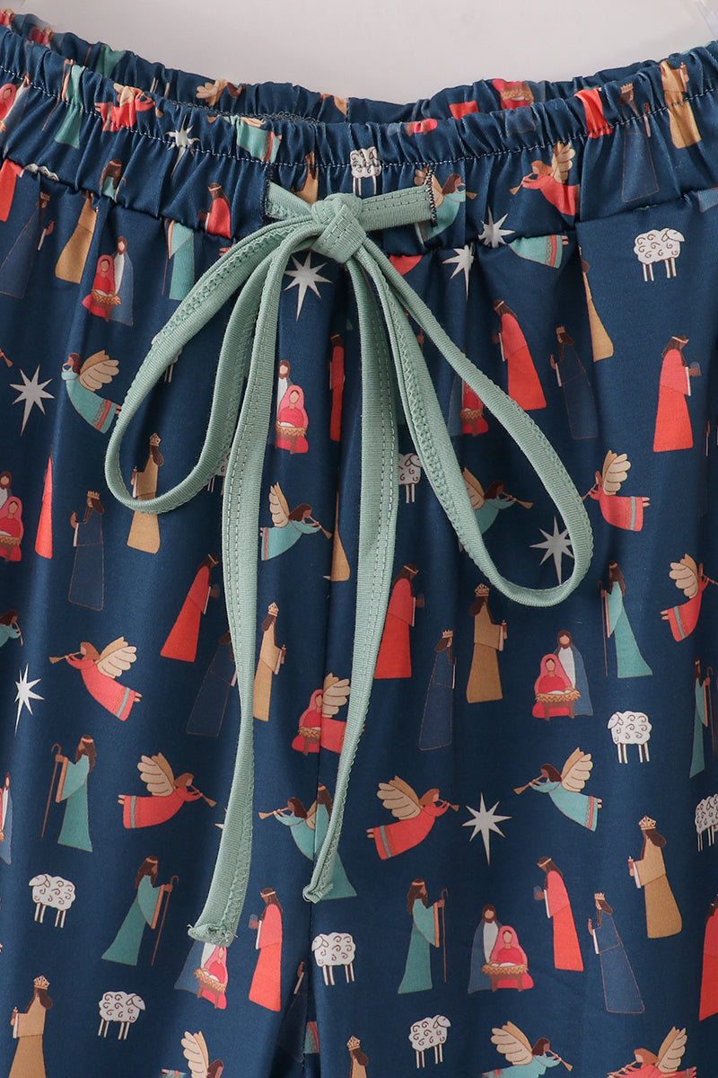 Navy blue fabric with colorful pattern and green drawstring