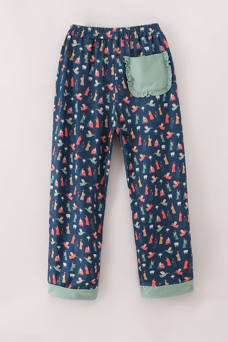 Navy blue pajama pants with colorful animal pattern on a white background