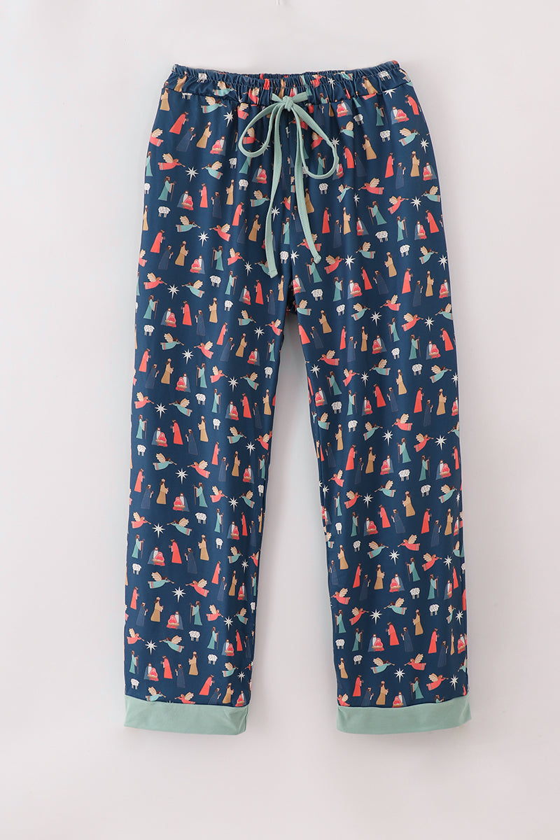 Navy blue pajama pants with colorful animal pattern on a white background