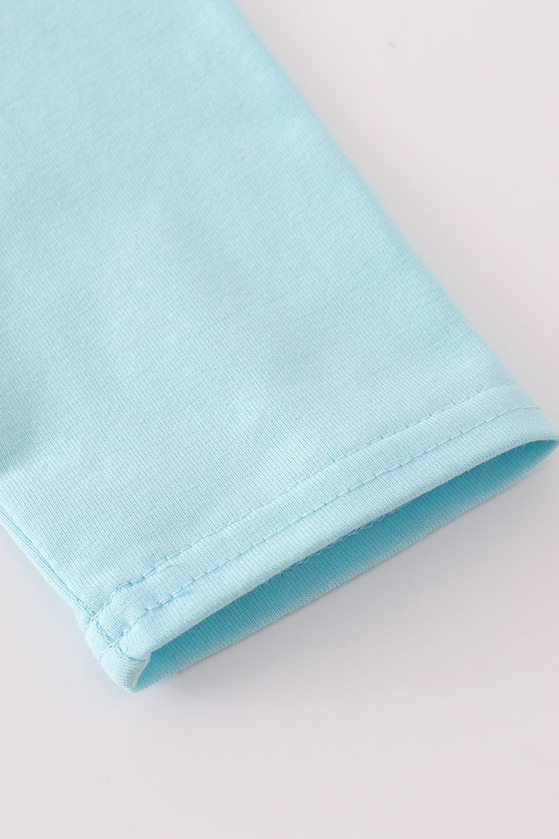 Close-up of a light blue fabric on a white background