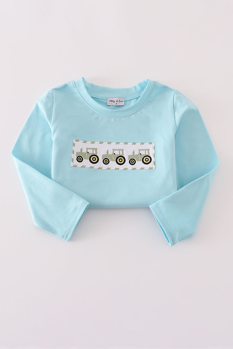 Light blue sweatshirt with a graphic design on a white background