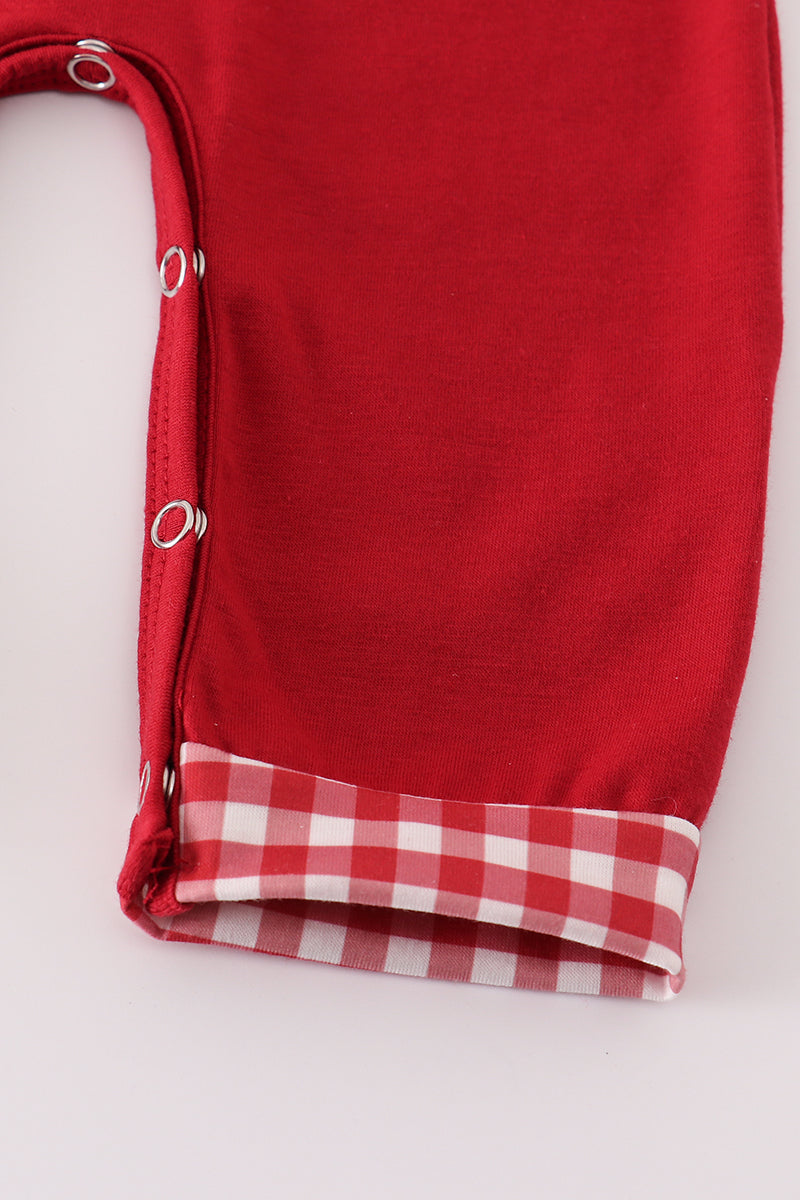 Red fabric with a checkered edge on a white background