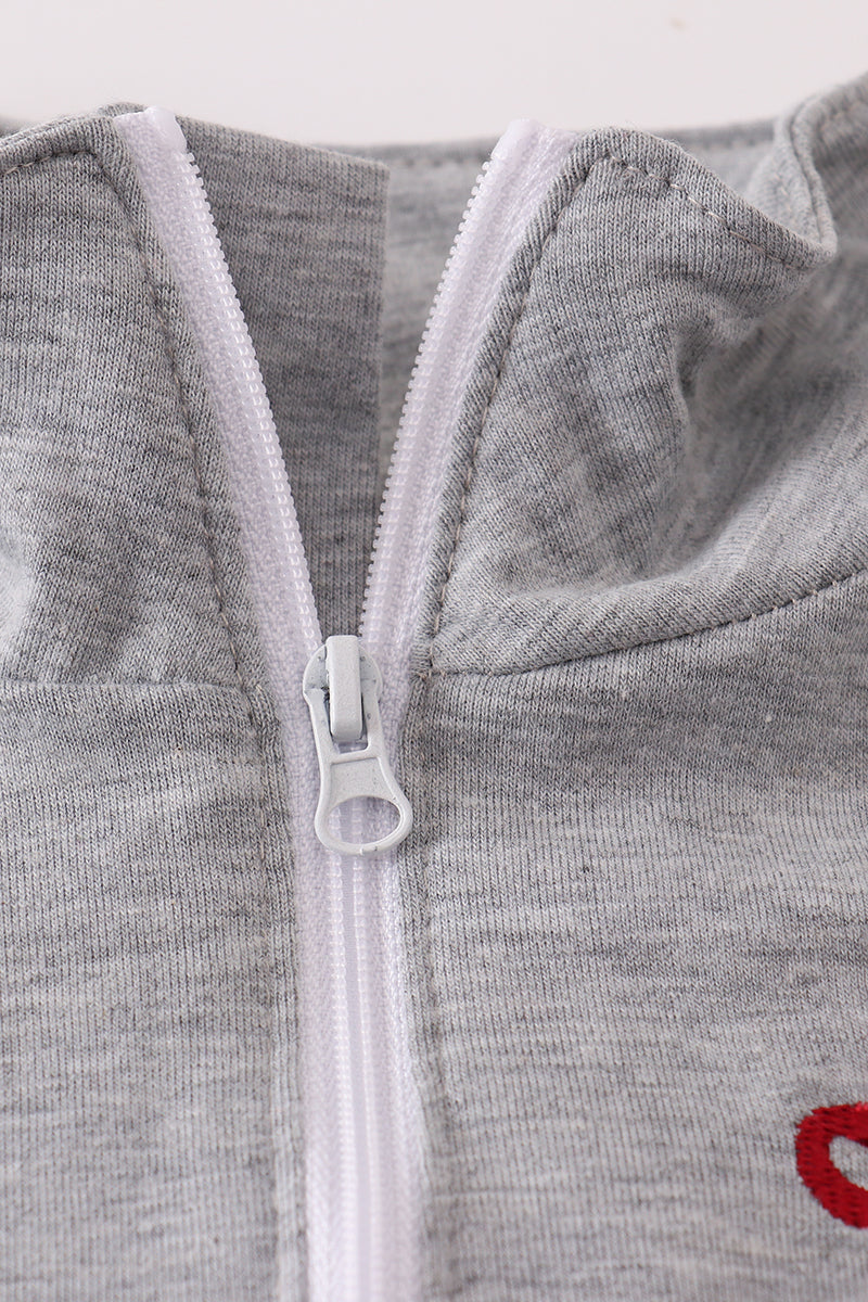 Gray zip-up hoodie with a red logo on a white background