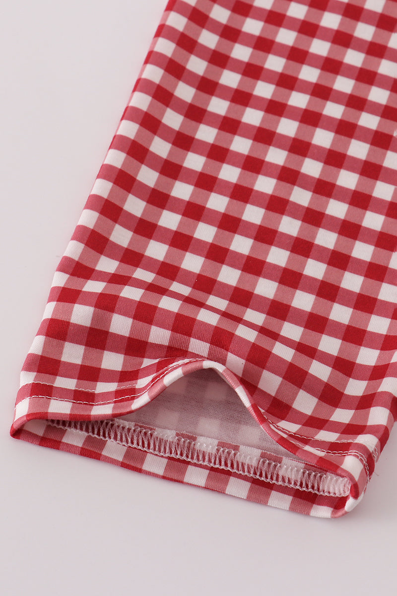 Red and white checkered fabric on a light gray background