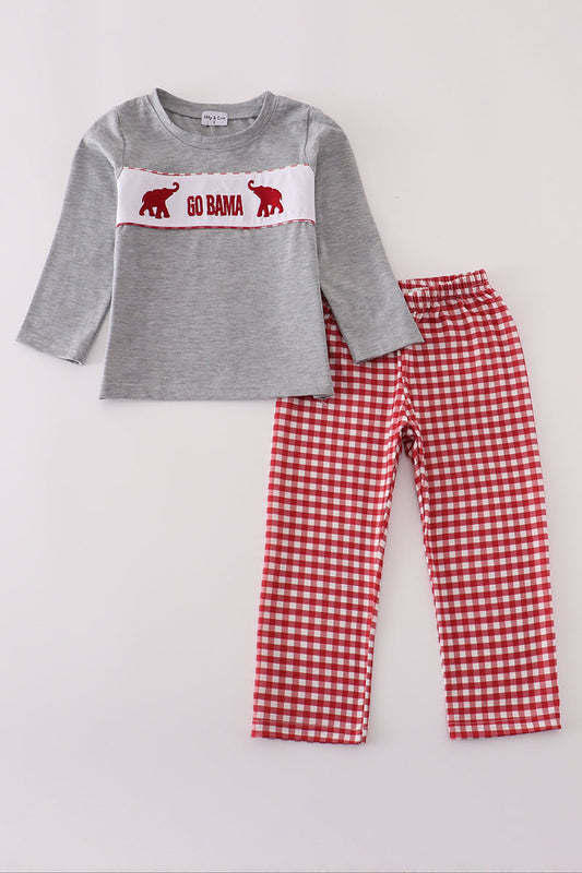 Gray long-sleeve shirt with red and white checkered pants on a light gray background