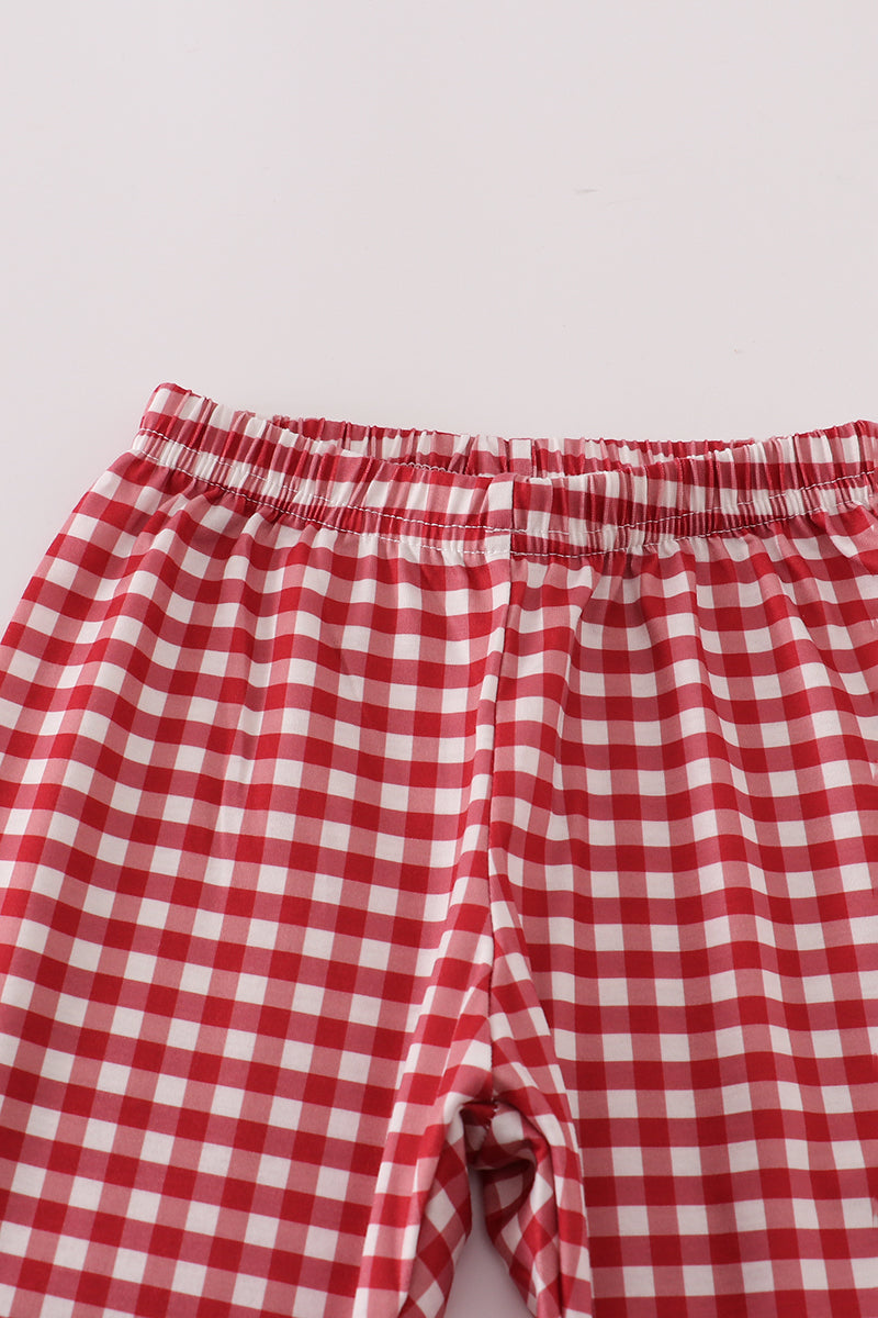 Red and white checkered shorts on a light gray background