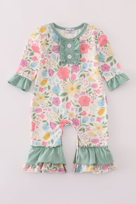 Floral baby romper with ruffled details on a light gray background