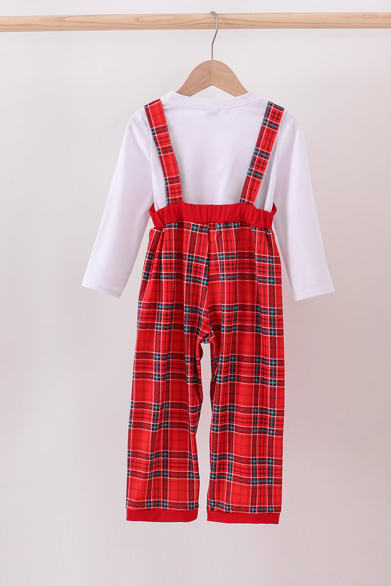 Red plaid overalls worn by a person on a hanger against a white background