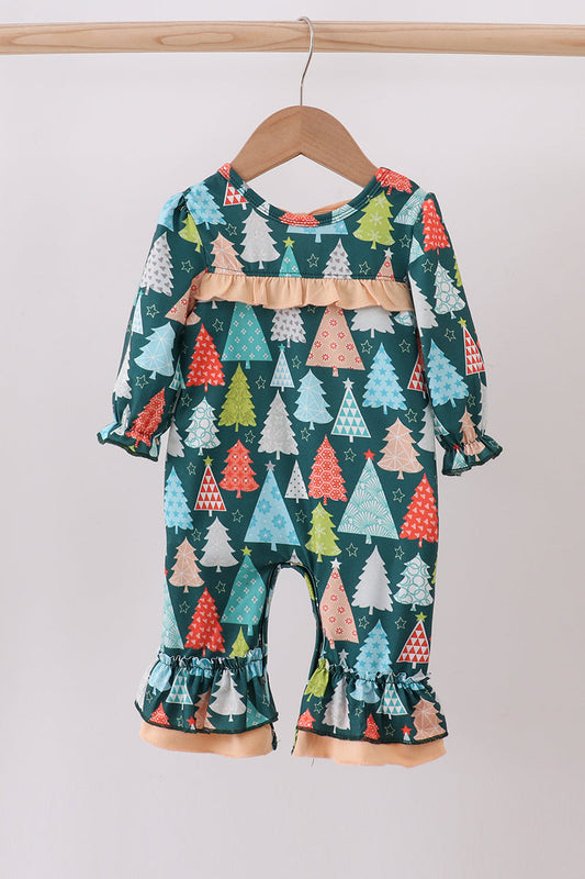 Children's outfit with tree pattern on a hanger against a white background