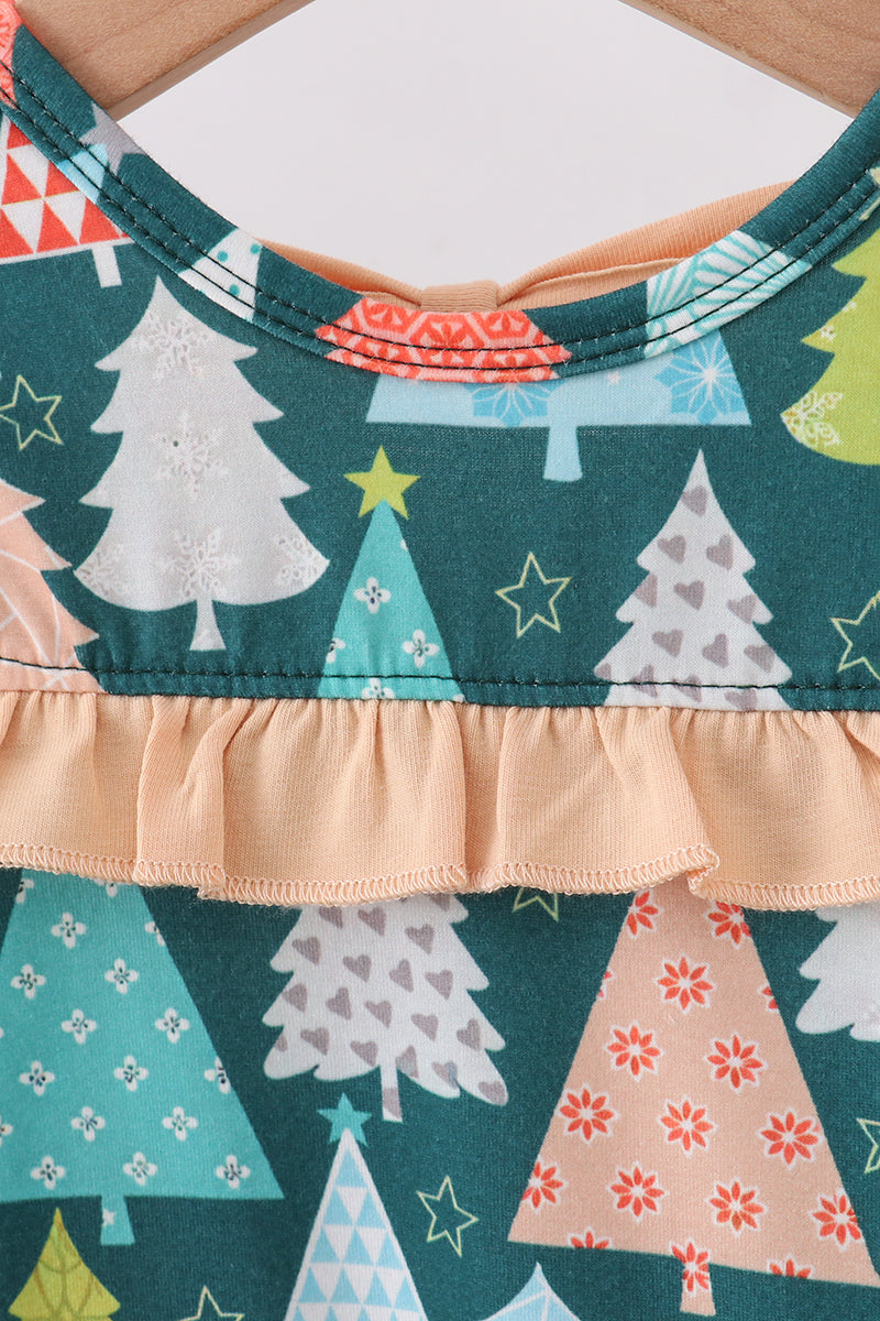 Close-up of a fabric with Christmas tree pattern on a green background