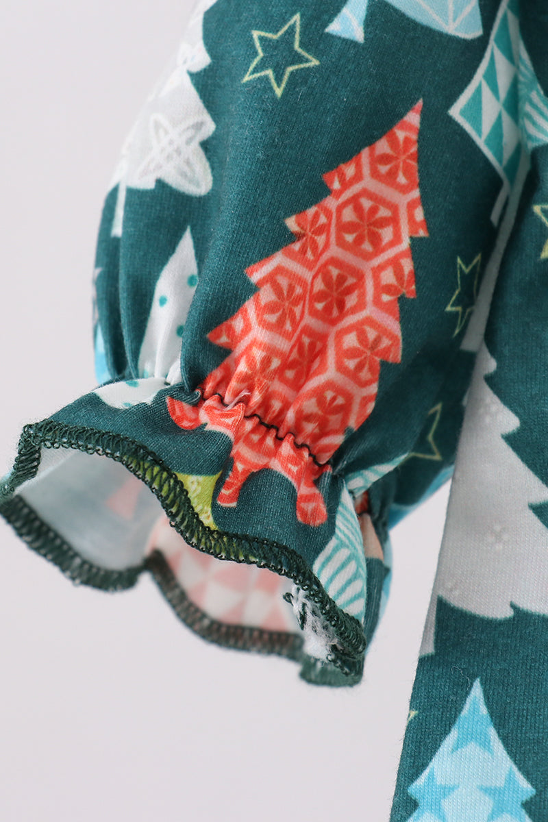 Close-up of a fabric with Christmas tree pattern on a white background