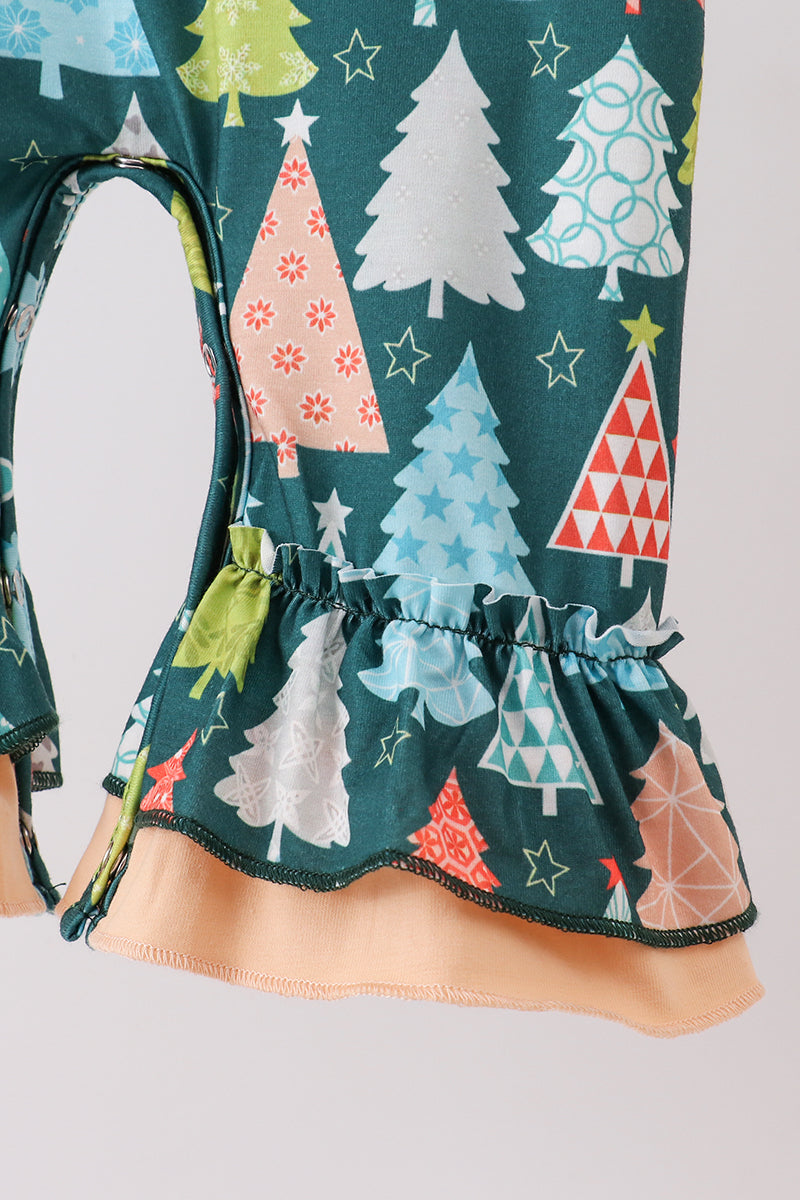 Children's dress with colorful tree pattern on a plain background
