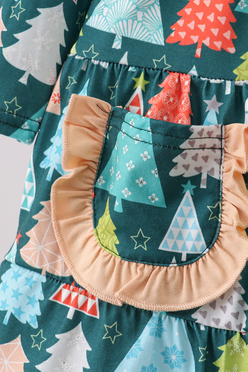 Children's dress with festive tree pattern and ruffled pocket on a white background