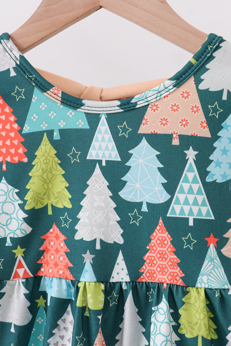 Close-up of a dress with Christmas tree pattern on a hanger