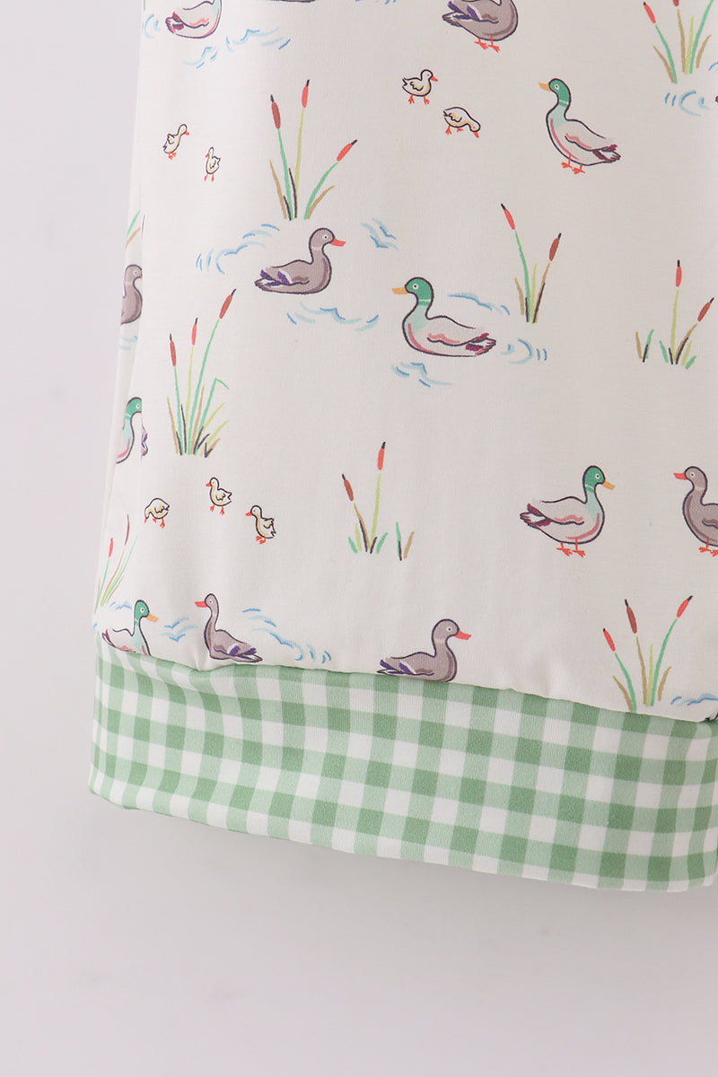 Dress with duck and reed pattern on a white background