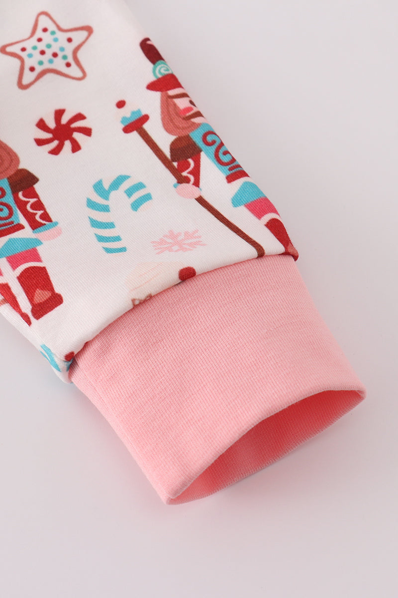 Folded fabric with Christmas-themed design on a white background
