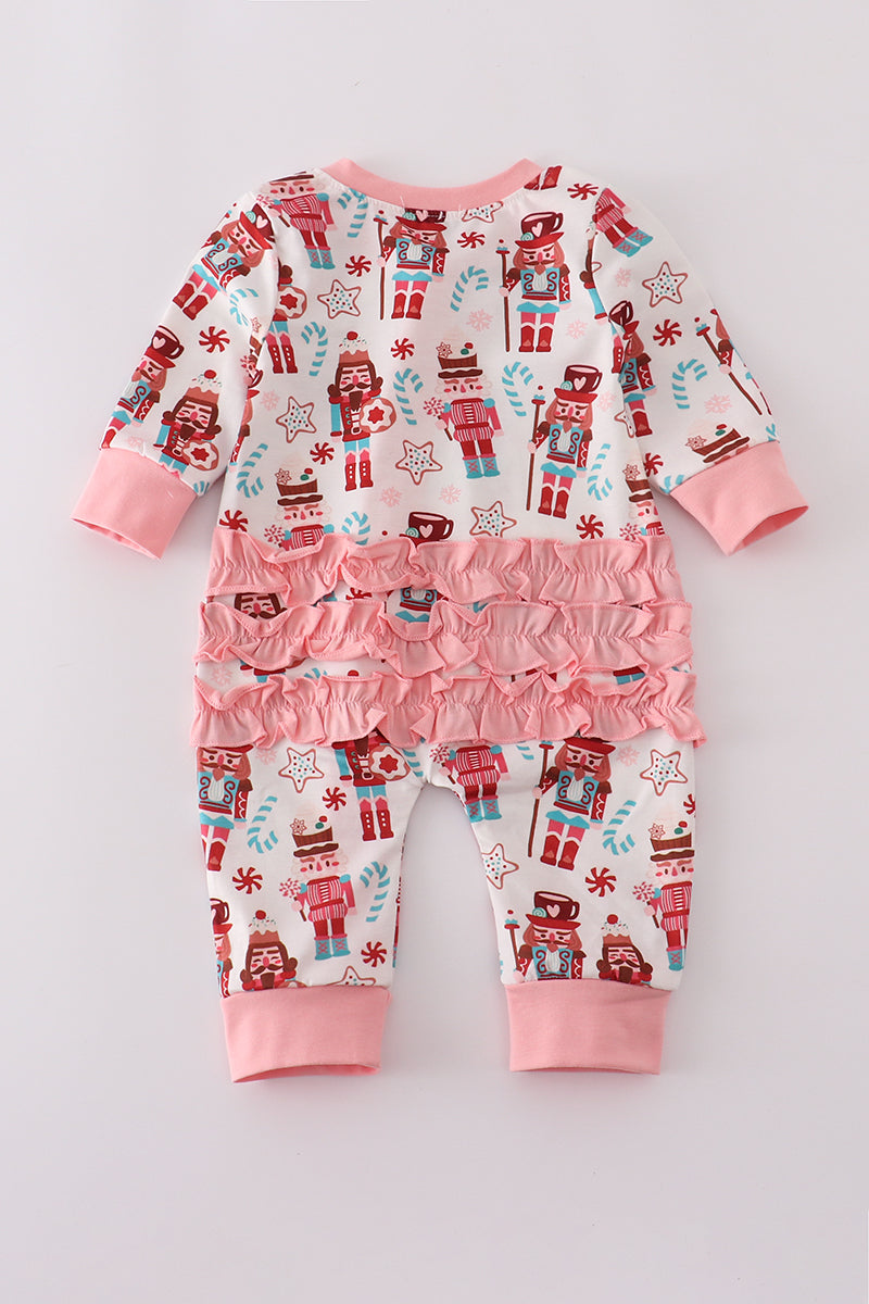 Children's pajama set with robot and candy cane pattern on a light gray background
