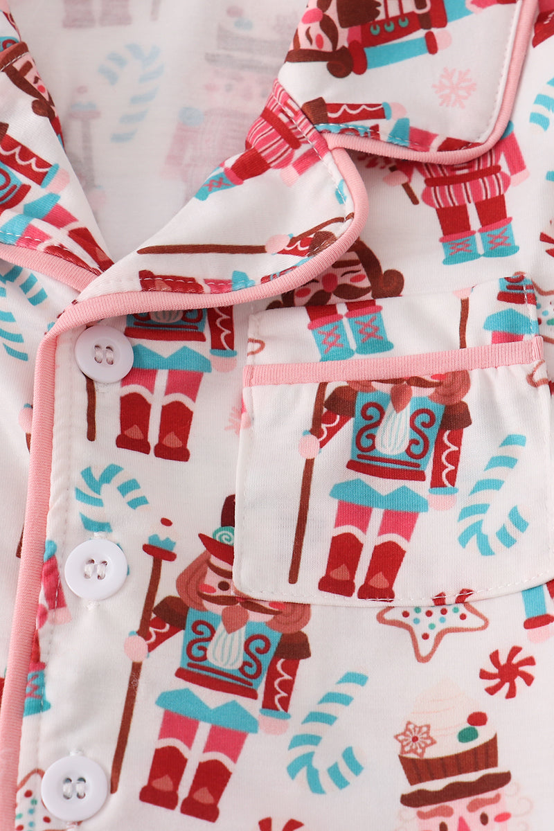 Children's pajama set with gingerbread man pattern on a white background