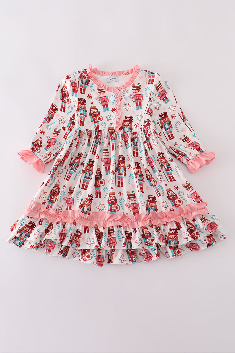 Children's nightgown with nutcracker print on a light gray background