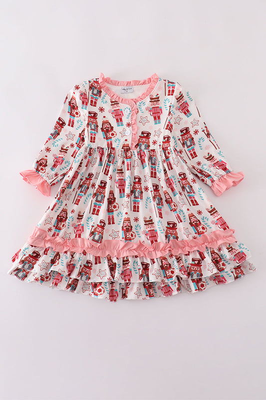 Children's nightgown with nutcracker print on a light gray background