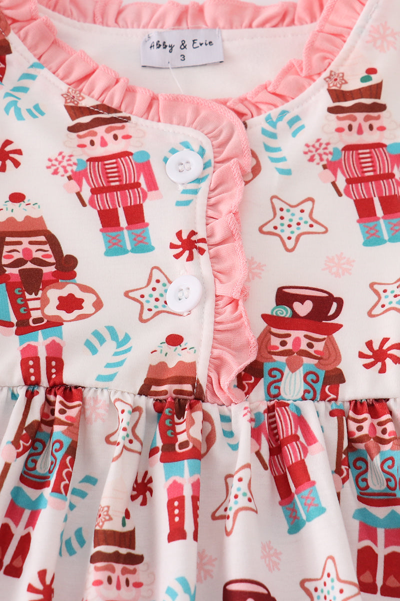 Children's dress with Nutcracker pattern and pink ruffle details, brand 'Lizzy & Eva' visible.