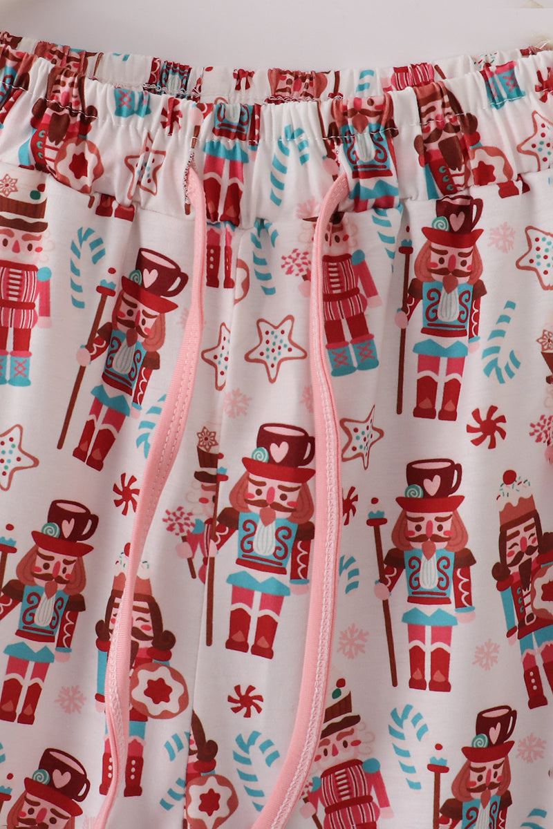 Decorative curtain with nutcracker pattern on a white background