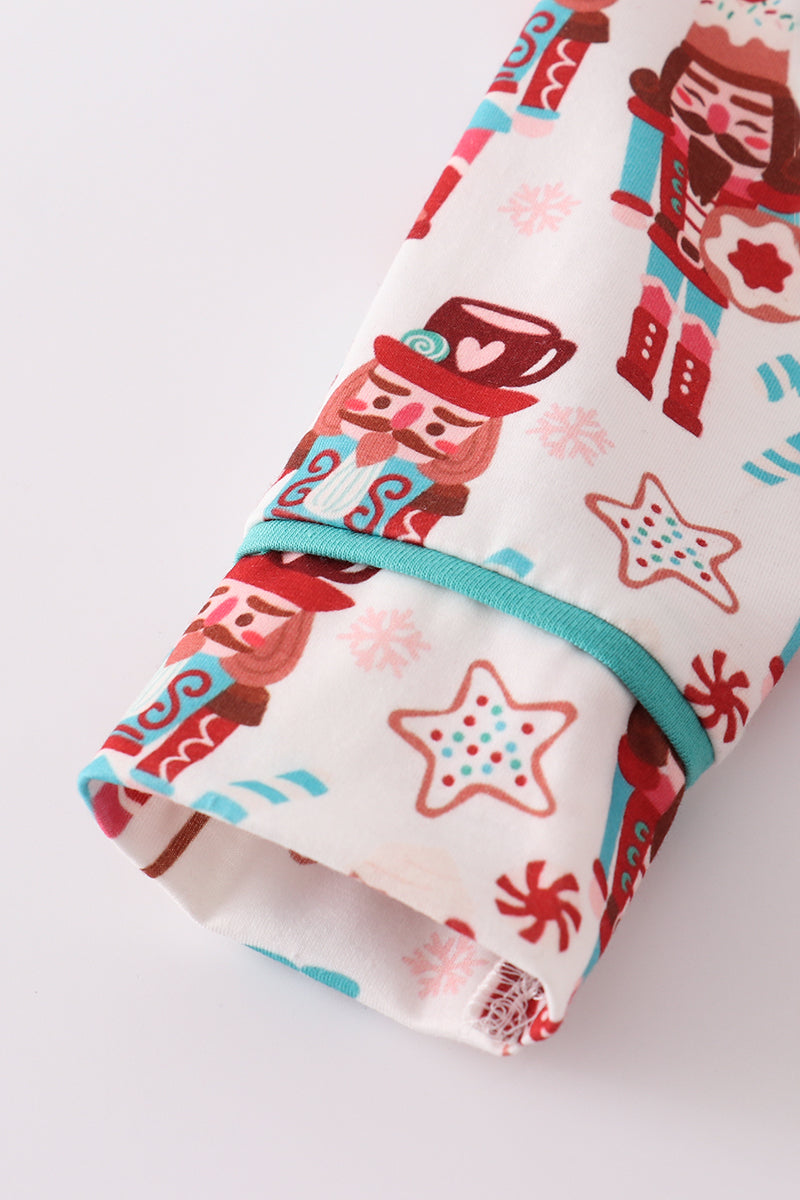 Folded fabric with nutcracker and star pattern on a white background