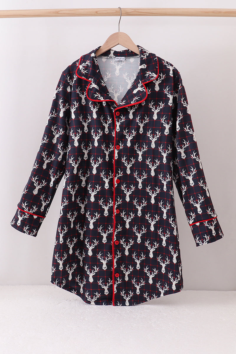 Flannel shirt with deer pattern on a hanger against a white background