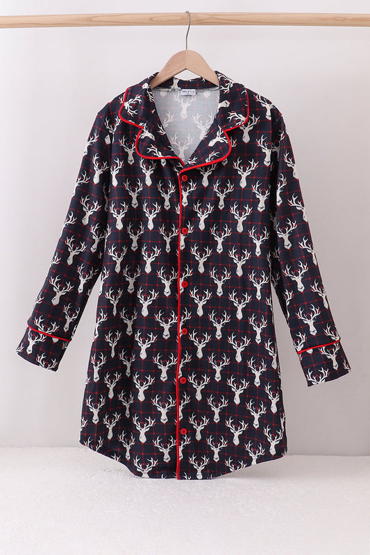 Flannel shirt with deer pattern on a hanger against a white background