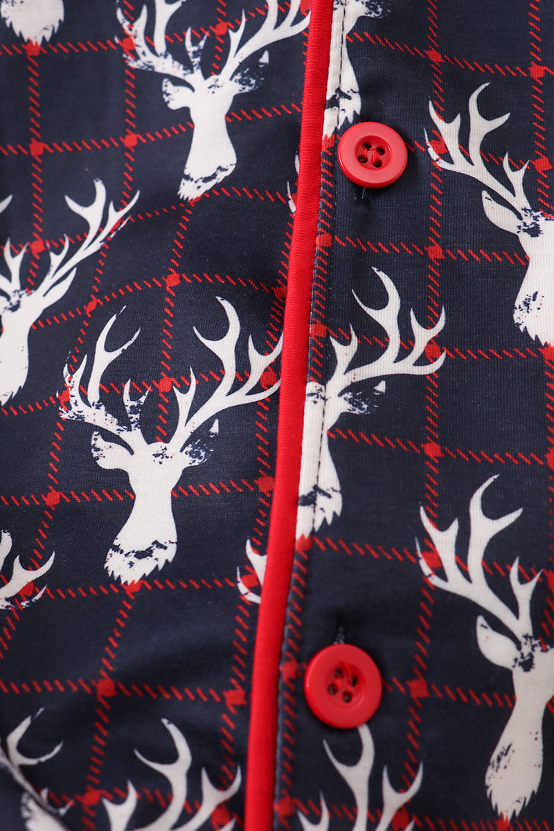 Navy blue fabric with white deer heads and red buttons