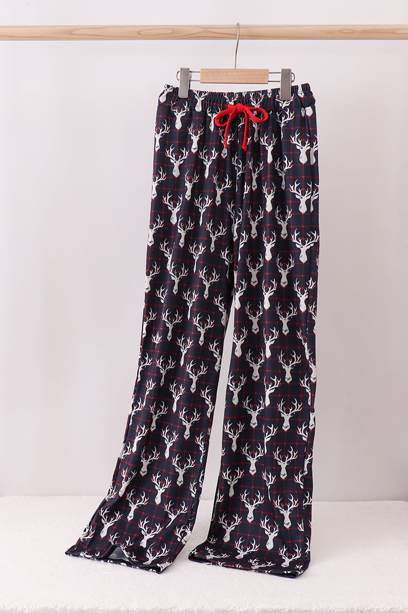Flannel pajama pants with deer pattern on a white background