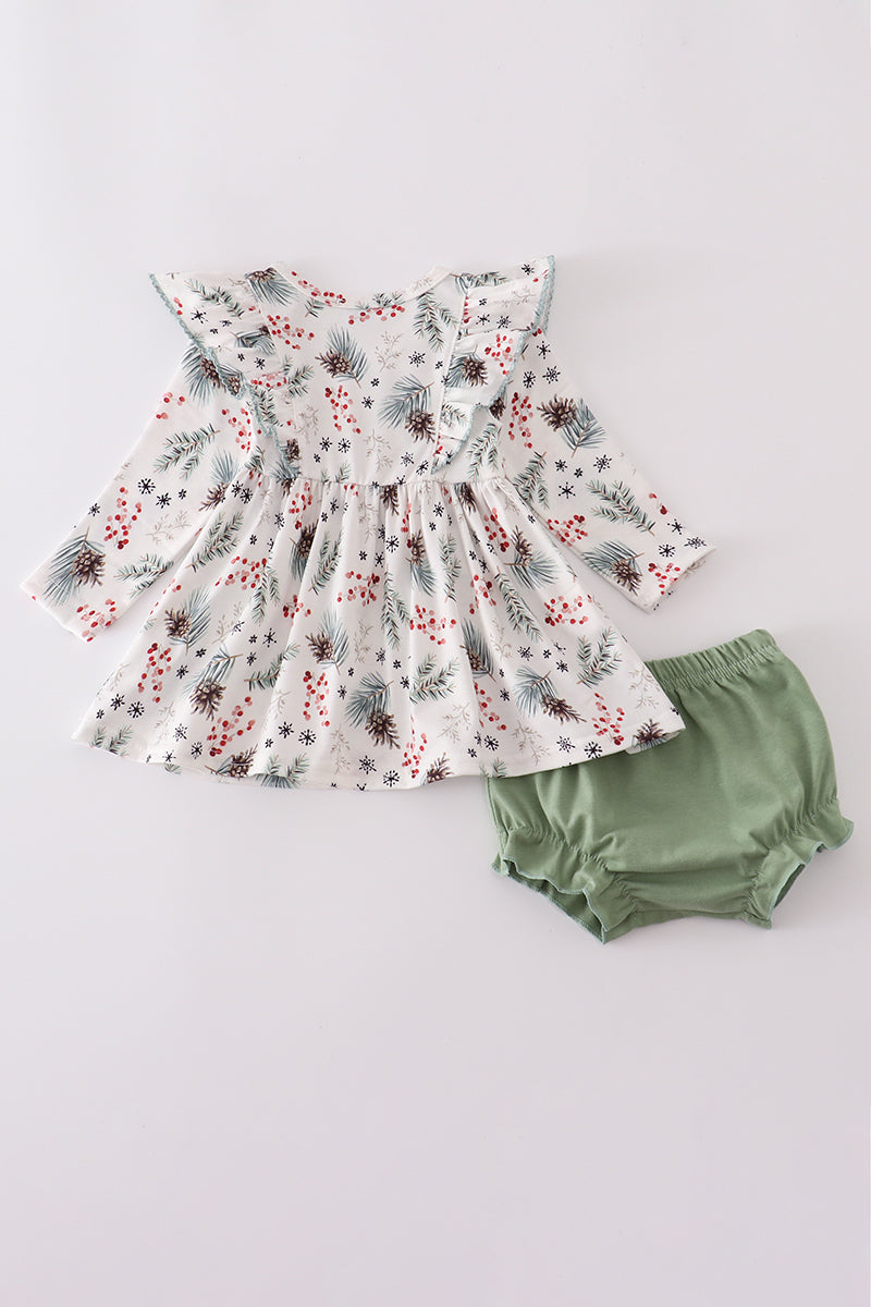 Floral dress and green bloomers on a light gray background