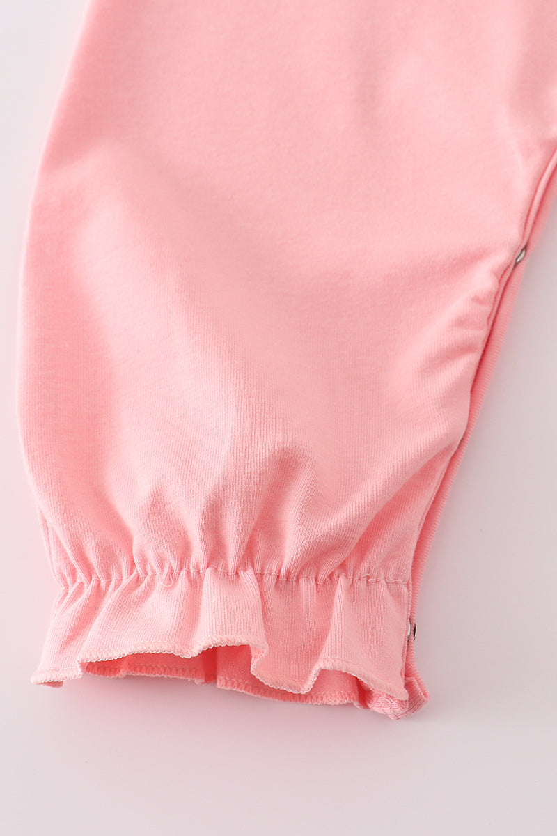 Close-up of a pink garment with a white background