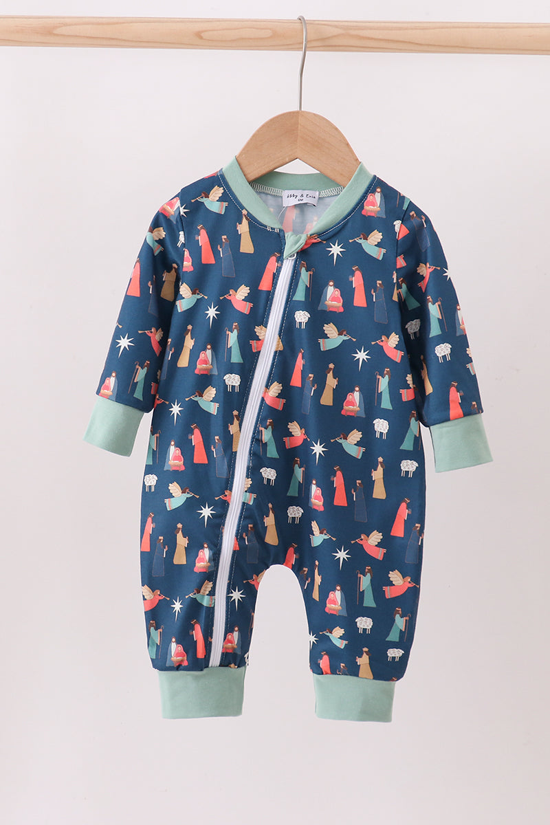 Baby onesie with colorful patterns on a hanger against a white background