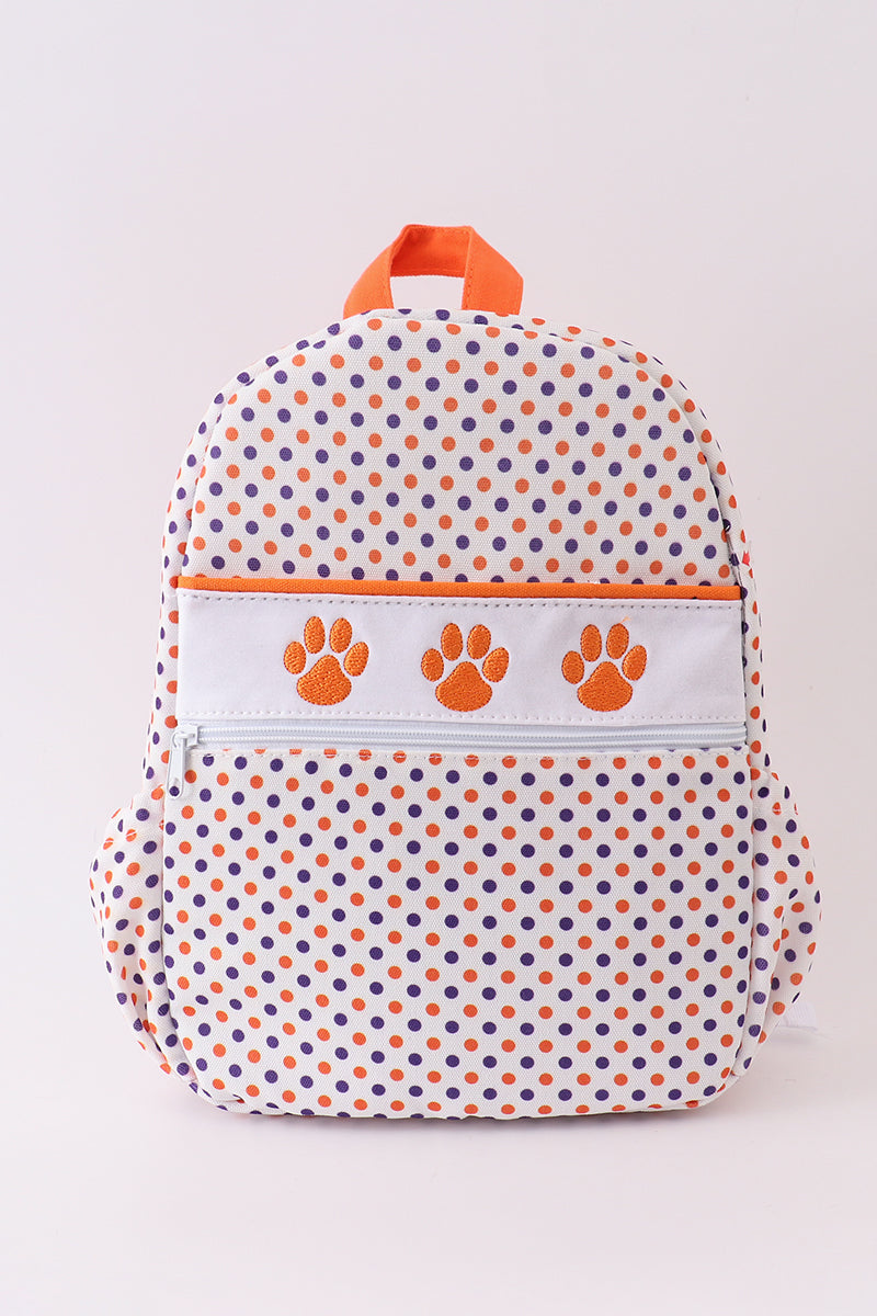 A Clemson university embroidered schoolbag in orange and white with a pattern of stars and a paw print design, featuring canvas fabric.