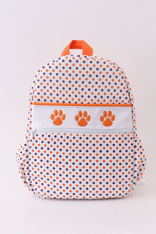 A Clemson university embroidered schoolbag in orange and white with a pattern of stars and a paw print design, featuring canvas fabric.