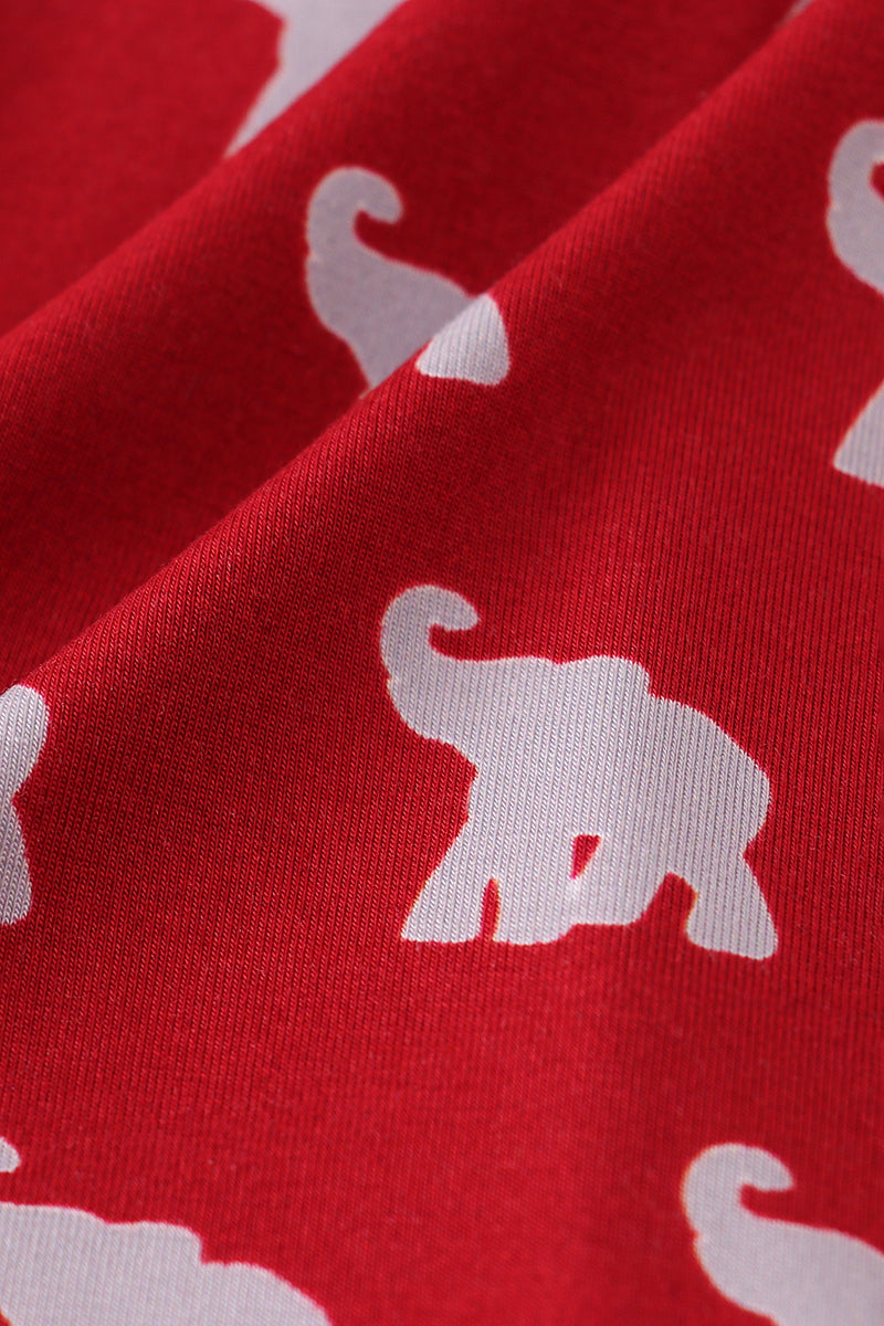 Red fabric with white elephant patterns