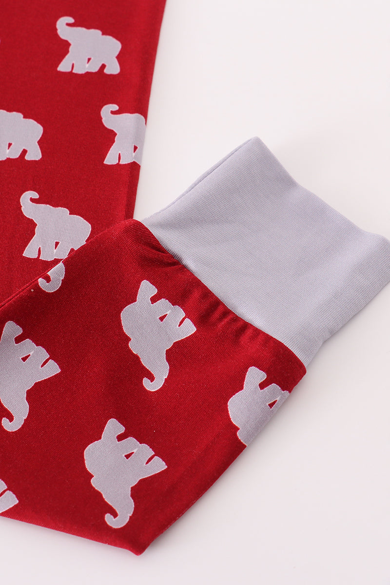 Red fabric with white elephant pattern and gray trim on a white background