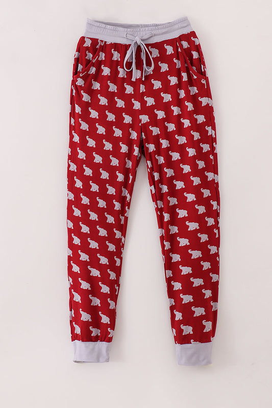 Red pajama pants with white bear pattern on a white background