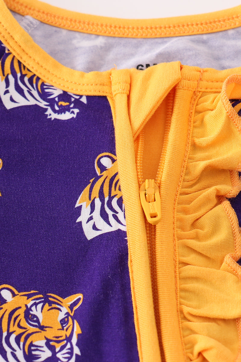 Close-up of a purple and yellow garment with tiger logos