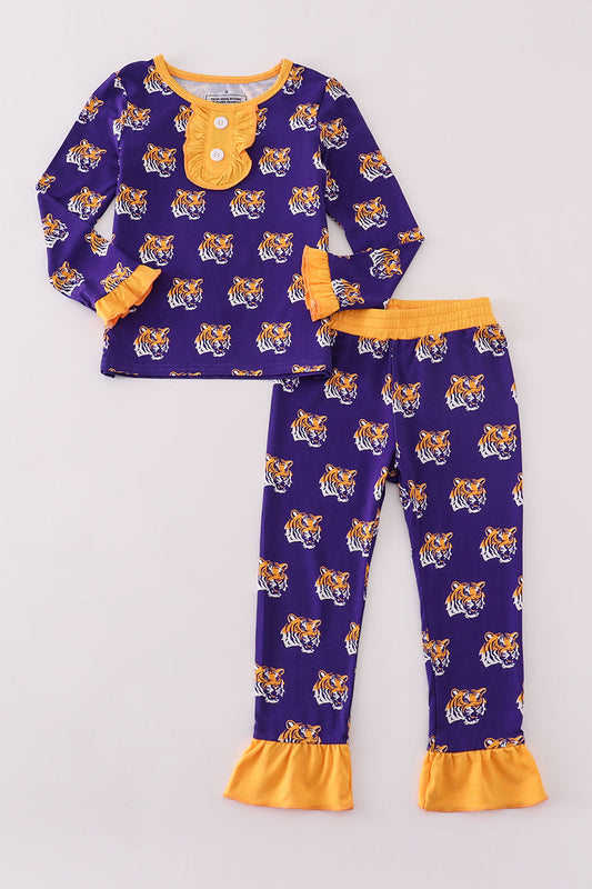 Purple children's pajama set with tiger pattern and yellow accents on a light gray background