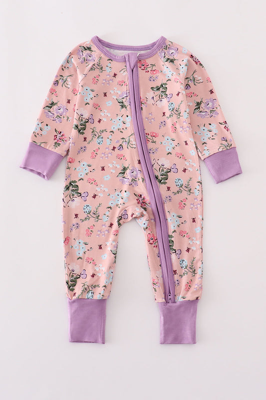 Floral baby onesie with purple accents on a white background