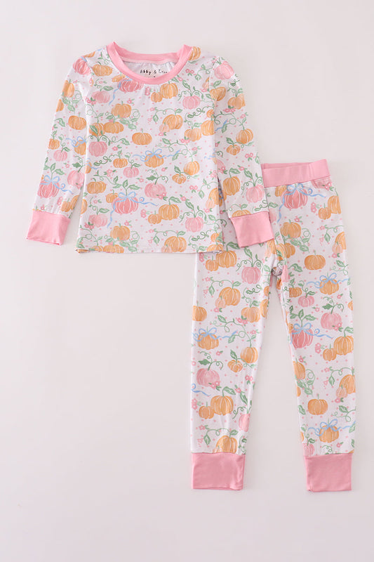 Children's pajama set with pumpkin pattern on a light background