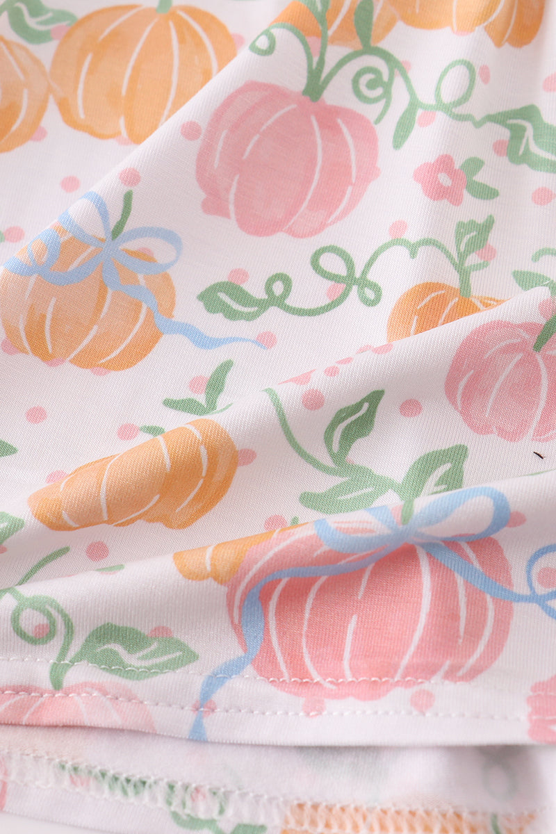 Fabric with colorful pumpkin pattern on a white background