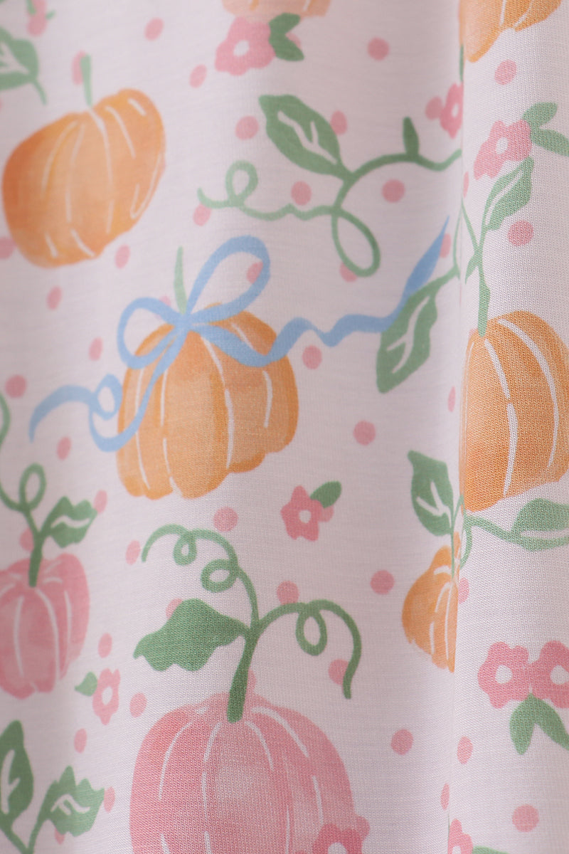Pattern of pumpkins, leaves, and flowers on a white background
