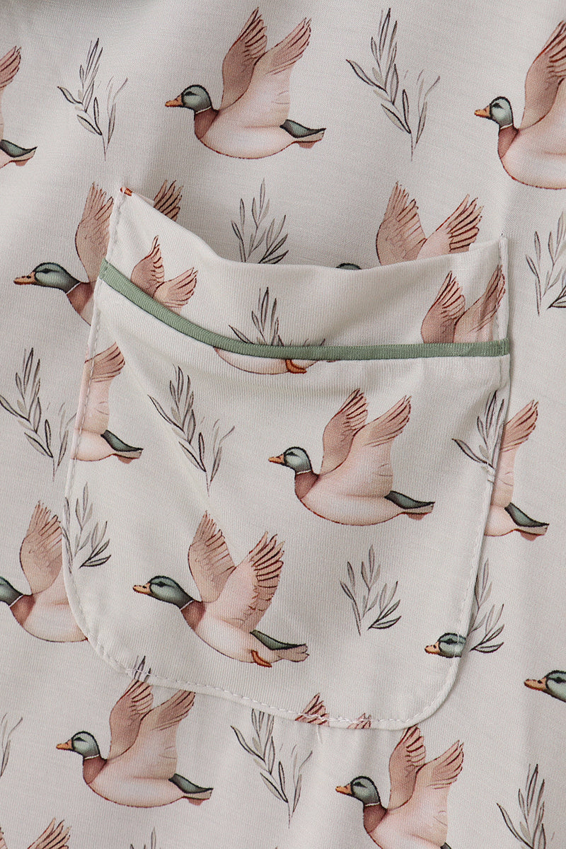 Baby blanket with duck pattern on a light background